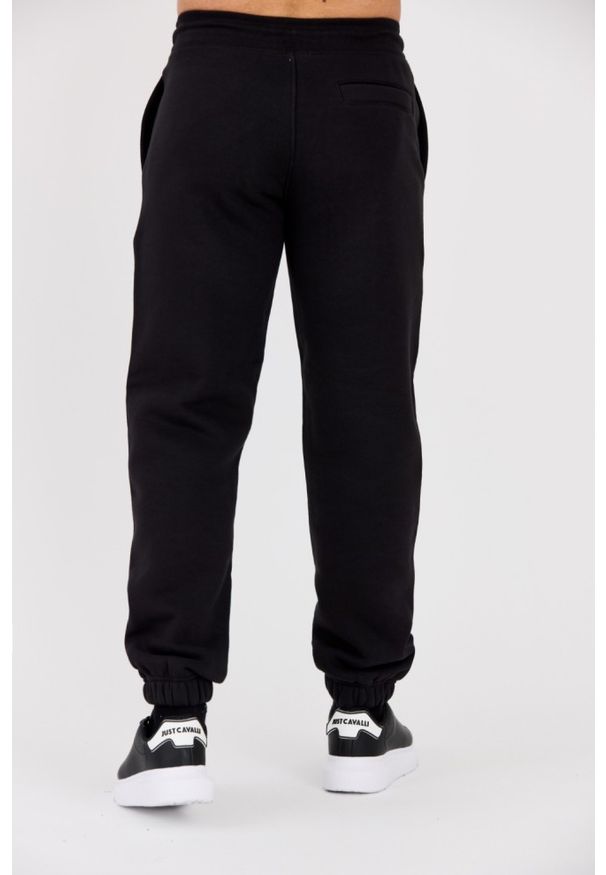 Calvin Klein - CALVIN KLEIN Czarne męskie spodnie dresowe. Kolor: czarny. Materiał: dresówka. Wzór: haft