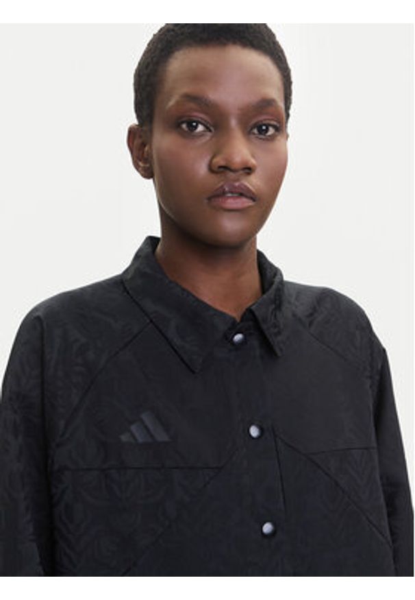 Adidas - adidas Kurtka przejściowa Tiro x Common Goal Coaches JL7647 Czarny Loose Fit. Kolor: czarny. Materiał: syntetyk