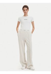 Calvin Klein Jeans Spodnie dresowe LV047G253G Kremowy Relaxed Fit. Kolor: kremowy. Materiał: bawełna #2