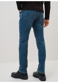 Ochnik - Granatowe jeansy męskie w stylu vintage. Kolor: niebieski. Materiał: bawełna. Styl: vintage