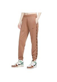 Nike - Spodnie Do Biegania Z Taśmą Dla Kobiet. Kolor: brązowy. Długość: długie #1