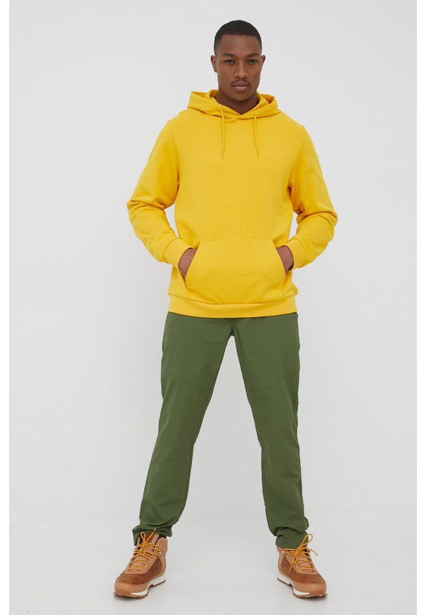 Jack Wolfskin bluza bawełniana męska kolor żółty z kapturem gładka. Typ kołnierza: kaptur. Kolor: żółty. Materiał: bawełna. Wzór: gładki