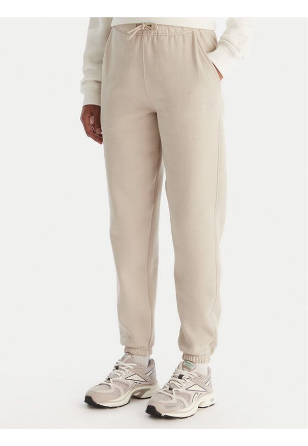 Reebok Spodnie dresowe Reebok X Ewa Chodakowska Evren RK25308CCW Beżowy Regular Fit. Kolor: beżowy. Materiał: bawełna, syntetyk