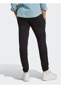 Adidas - adidas Spodnie dresowe Essentials Single Jersey Tapered Elasticized Cuff Logo Joggers IC0055 Czarny Regular Fit. Kolor: czarny. Materiał: bawełna #3