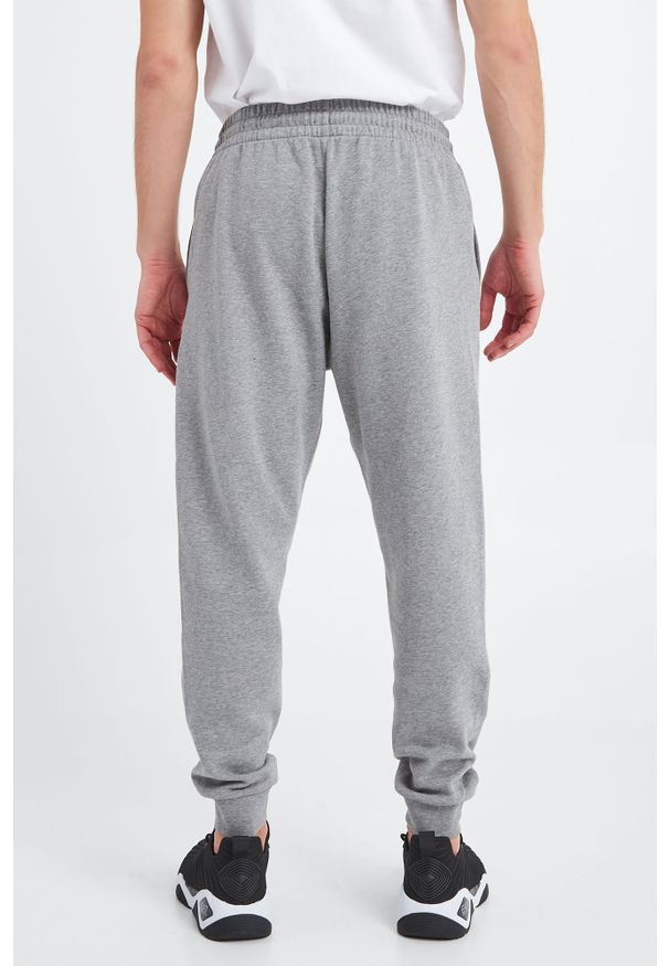EA7 Emporio Armani - Spodnie dresowe EA7 EMPORIO ARMANI. Materiał: dresówka. Wzór: nadruk, melanż