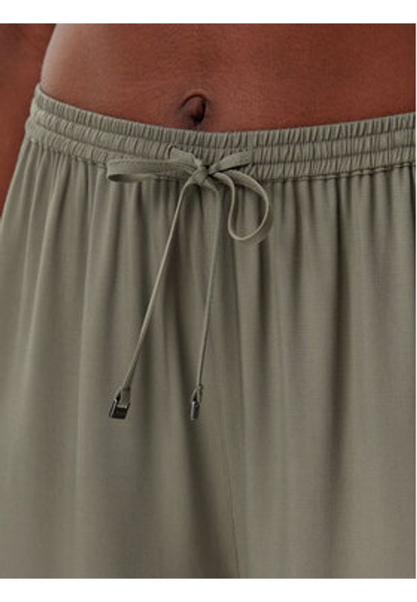 Calvin Klein Swimwear Spodnie materiałowe KW0KW02823 Zielony Relaxed Fit. Kolor: zielony. Materiał: wiskoza