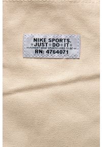 Nike Sportswear - Torebka. Kolor: kremowy. Wzór: nadruk. Rodzaj torebki: na ramię #4