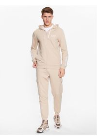 Dres EA7 Emporio Armani. Kolor: beżowy. Materiał: syntetyk, dresówka #1