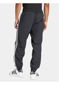 Adidas - adidas Spodnie dresowe Adicolor Woven Firebird IT2501 Czarny Regular Fit. Kolor: czarny. Materiał: syntetyk #2