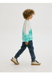 Reserved - Elastyczne jeansy jogger - granatowy. Kolor: niebieski