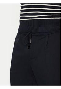 TOMMY HILFIGER - Tommy Hilfiger Spodnie materiałowe Punto MW0MW39197 Granatowy Regular Fit. Kolor: niebieski. Materiał: syntetyk