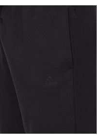 Adidas - adidas Spodnie dresowe ALL SZN IW1184 Czarny Regular Fit. Kolor: czarny. Materiał: bawełna