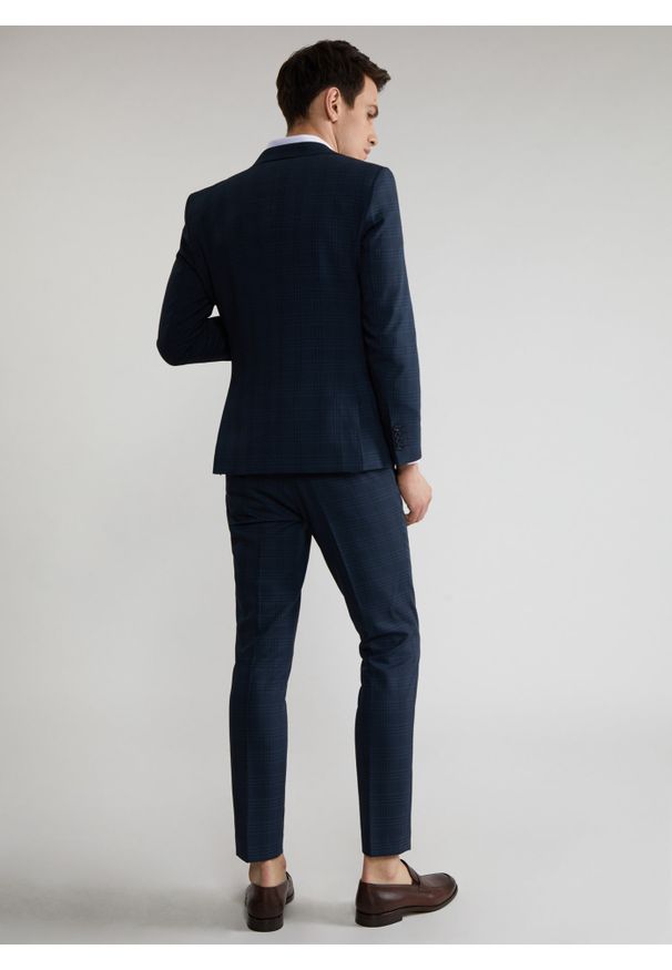Pako Lorente - Granatowe spodnie garniturowe w subtelną kratę P22SF-6G-024-G-S. Kolor: niebieski. Materiał: poliester, wiskoza, elastan