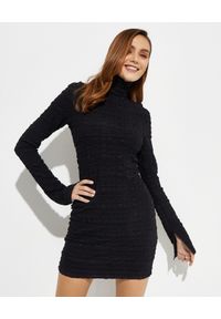 NANUSHKA - Czarna sukienka mini Velma. Typ kołnierza: golf. Kolor: czarny. Materiał: tkanina. Długość rękawa: długi rękaw. Typ sukienki: dopasowane. Długość: mini #1