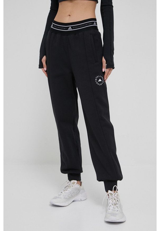 Adidas by Stella McCartney - adidas by Stella McCartney spodnie dresowe damskie kolor czarny gładkie. Kolor: czarny. Materiał: dresówka. Wzór: gładki