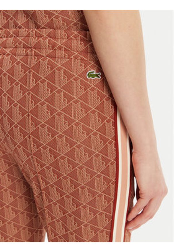 Lacoste Spodnie dresowe XF9313 Pomarańczowy Regular Fit. Kolor: pomarańczowy. Materiał: bawełna, syntetyk