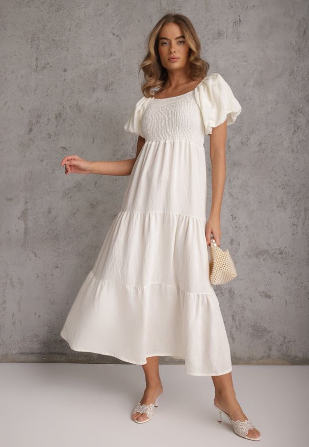 Renee - Jasnobeżowa Sukienka z Wiskozy o Rozkloszowanym Kroju z Bufiastymi Rękawkami Rosena. Kolor: beżowy. Materiał: wiskoza. Długość rękawa: krótki rękaw. Sezon: lato. Typ sukienki: rozkloszowane. Długość: maxi