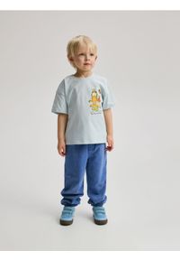 Reserved - Dresowe spodnie z efektem sprania - niebieski. Kolor: niebieski. Materiał: dresówka