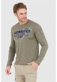 Aeronautica Militare - AERONAUTICA MILITARE Khaki longsleeve męski z dużym aksamitnym logo. Kolor: zielony. Materiał: jersey. Długość rękawa: długi rękaw. Wzór: nadruk