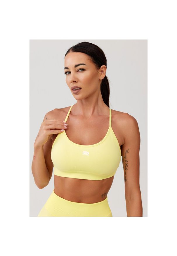 ROUGH RADICAL - Stanik sportowy bezszwowy Rough Radical Seamless Glow Bra. Kolor: żółty. Sport: joga i pilates