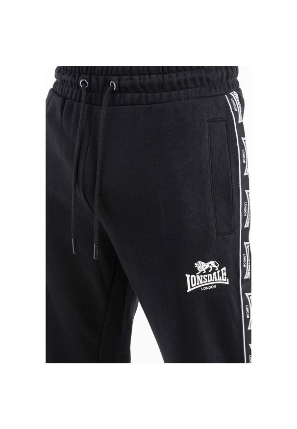 Spodnie dresowe klasyczne Lonsdale Grutness. Kolor: czarny, biały, wielokolorowy. Materiał: dresówka. Długość: długie. Styl: klasyczny