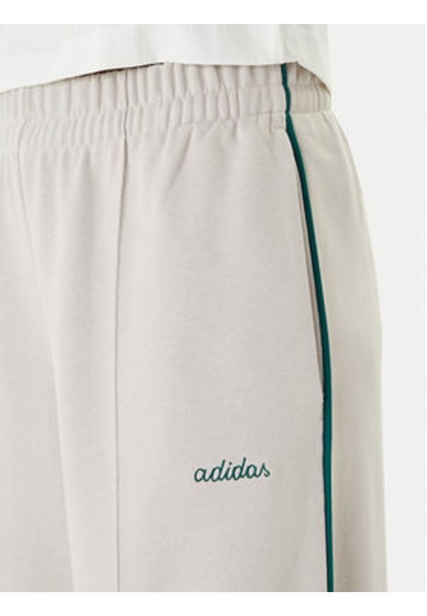 Adidas - adidas Spodnie dresowe Seasonal Essentials Colourpop JZ0192 Beżowy Regular Fit. Kolor: beżowy. Materiał: bawełna