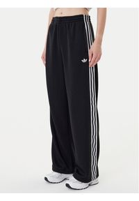 Adidas - adidas Spodnie dresowe adicolor Firebird JV7525 Czarny Regular Fit. Kolor: czarny. Materiał: syntetyk #1