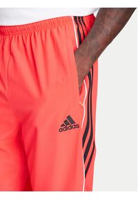 Adidas - adidas Spodnie dresowe Teamgeist adicolor JW5871 Czerwony Loose Fit. Kolor: czerwony. Materiał: syntetyk #3