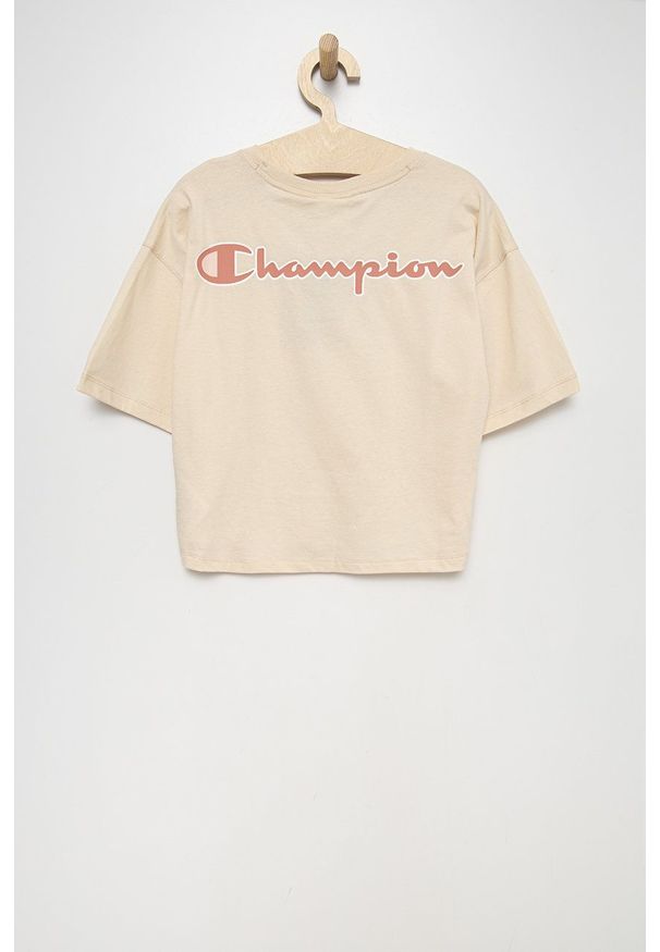 Champion t-shirt bawełniany dziecięcy kolor beżowy. Kolor: beżowy. Materiał: bawełna. Długość rękawa: krótki rękaw. Długość: krótkie. Wzór: aplikacja