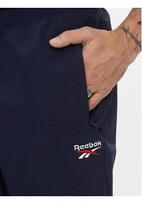 Reebok Spodnie dresowe Classics Vector Tracksuit Bottoms H54439 Niebieski Slim Fit. Kolor: niebieski. Materiał: syntetyk