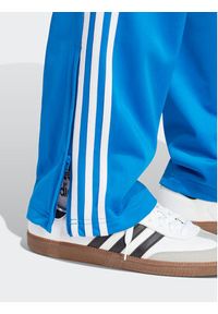Adidas - adidas Spodnie dresowe adicolor Classics Firebird IJ7056 Niebieski Regular Fit. Kolor: niebieski. Materiał: syntetyk #3