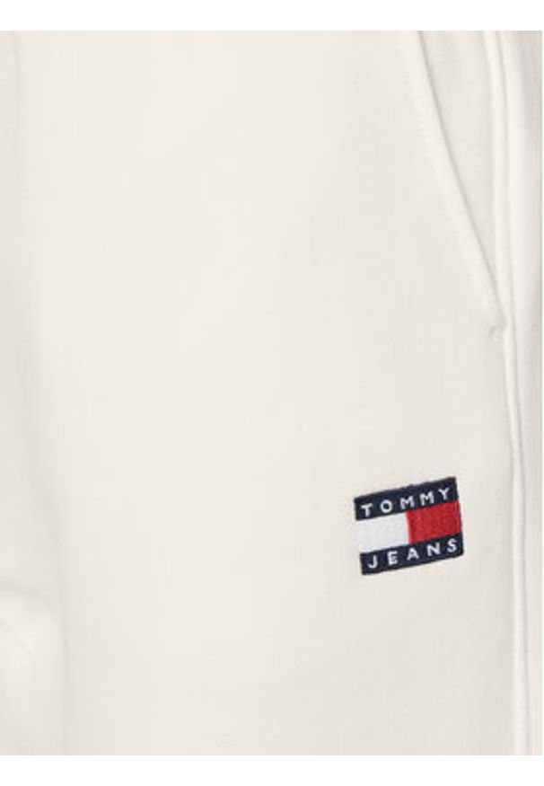 Tommy Jeans Spodnie dresowe Badge DW0DW20679 Écru Regular Fit. Materiał: bawełna