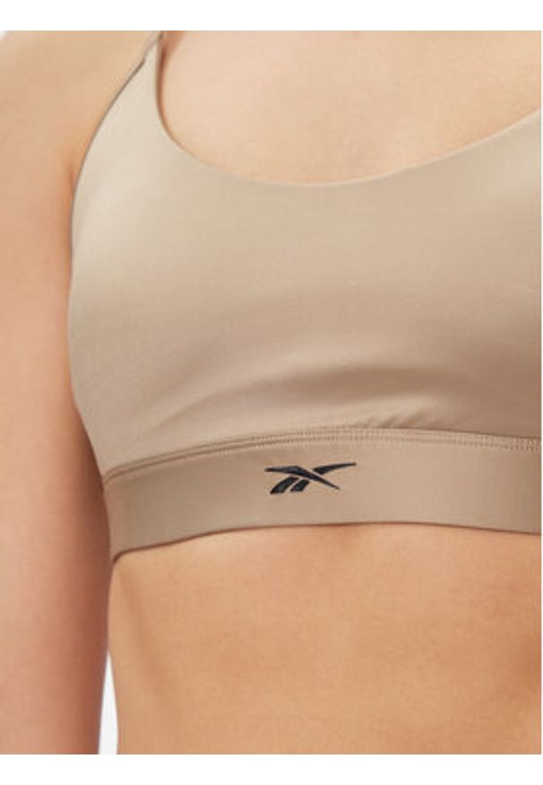 Reebok Biustonosz sportowy Holiday Lux IL4589 Beżowy. Kolor: beżowy. Materiał: syntetyk