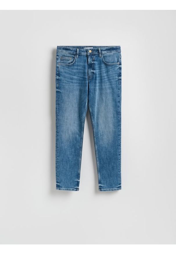 Reserved - Jeansy slim z efektem sprania - niebieski. Kolor: niebieski