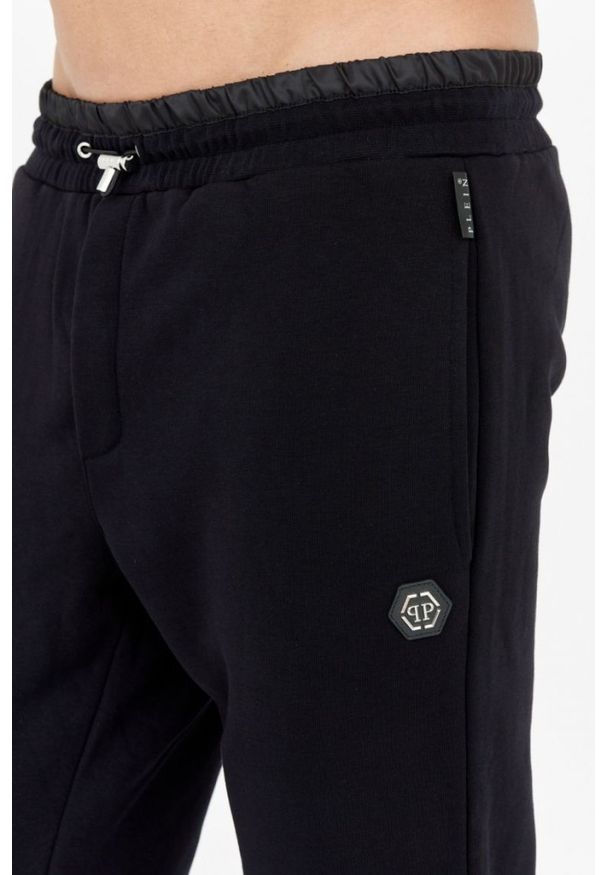 Philipp Plein - PHILIPP PLEIN Czarne spodnie dresowe męskie hexagon. Kolor: czarny. Materiał: dresówka. Sport: bieganie