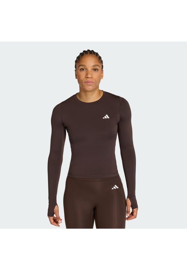 Adidas - Koszulka Power Essentials Workout Contour Long Sleeve. Kolor: brązowy. Długość rękawa: długi rękaw. Technologia: ClimaCool (Adidas). Długość: długie. Sport: fitness