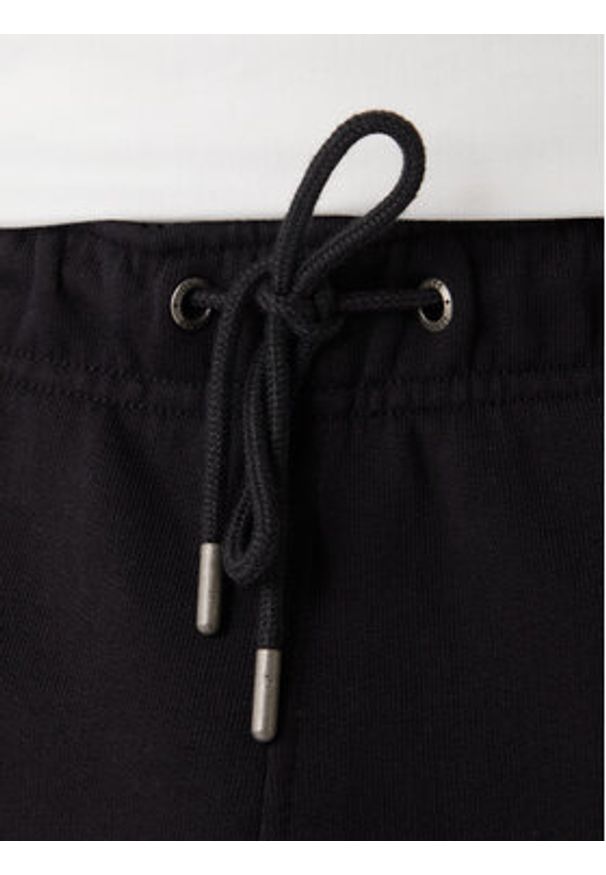 Guess Jeans Spodnie dresowe M6RB70 KCPR1 Czarny Regular Fit. Kolor: czarny. Materiał: bawełna