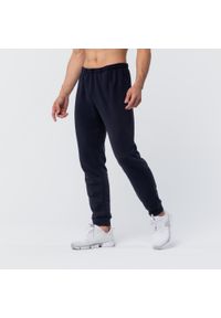 DOMYOS - Spodnie dresowe męskie Domyos Gym & Pilates 100. Kolor: niebieski. Materiał: bawełna, materiał, poliester. Wzór: ze splotem. Sport: joga i pilates