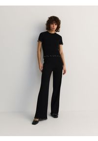 Reserved - Dzianinowe spodnie z ozdobnym wykończeniem - czarny. Kolor: czarny. Materiał: dzianina #1