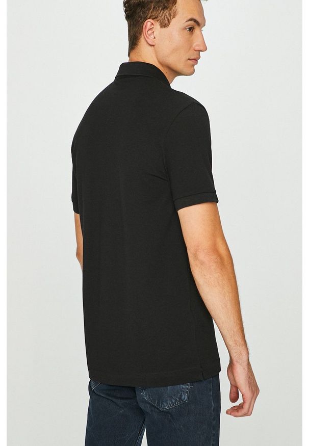 Lacoste - Polo. Okazja: na co dzień. Typ kołnierza: polo. Kolor: czarny. Materiał: dzianina. Długość: krótkie. Styl: casual