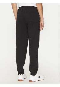 Champion Spodnie dresowe 220434 Czarny Loose Fit. Kolor: czarny. Materiał: bawełna