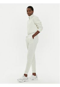 Calvin Klein Performance Spodnie dresowe 00GWS4P651 Beżowy Relaxed Fit. Kolor: beżowy. Materiał: syntetyk