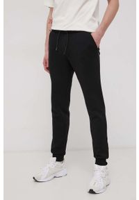 Jack & Jones Spodnie męskie kolor czarny gładkie. Kolor: czarny. Materiał: dzianina. Wzór: gładki