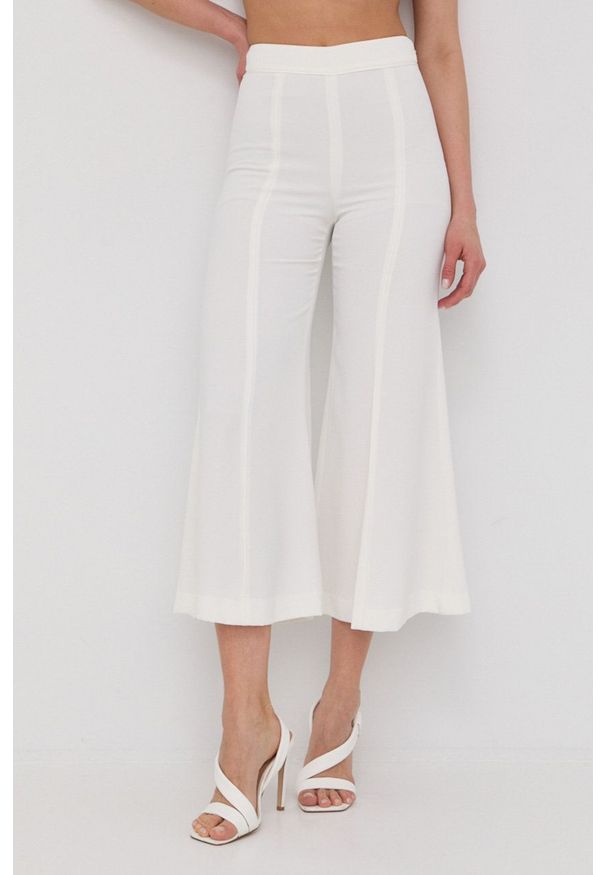 TwinSet - Twinset spodnie damskie kolor biały dzwony high waist. Stan: podwyższony. Kolor: biały. Materiał: tkanina