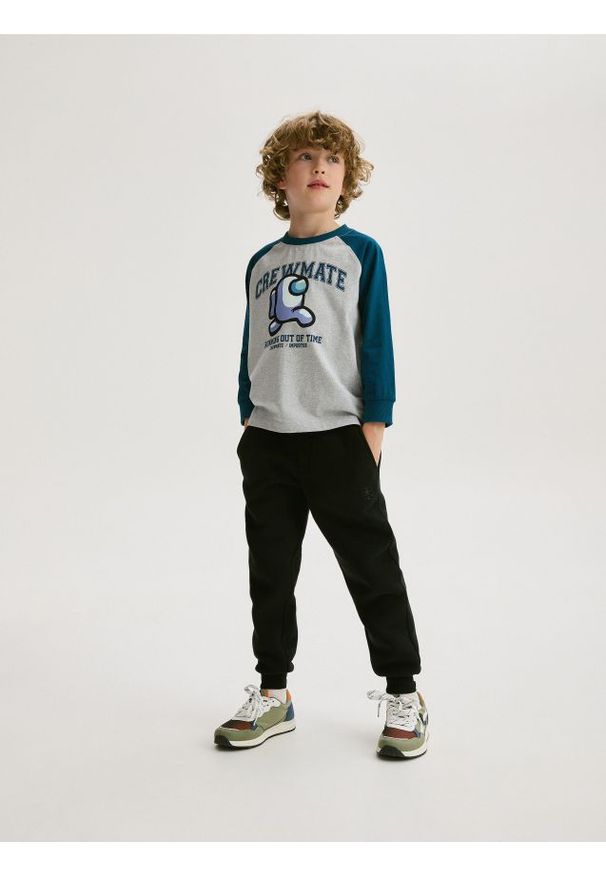 Reserved - Dresowe spodnie jogger - czarny. Kolor: czarny. Materiał: dresówka