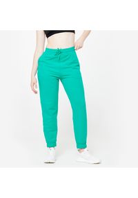 DOMYOS - Spodnie dresowe damskie Domyos Gym & Pilates. Kolor: zielony. Materiał: materiał, elastan, poliester, bawełna. Wzór: ze splotem. Sport: joga i pilates