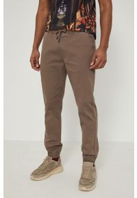 medicine - Medicine Spodnie męskie kolor brązowy joggery. Kolor: brązowy. Materiał: tkanina. Wzór: gładki #5