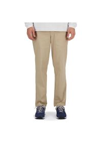 Spodnie New Balance MP41575SOT - beżowe. Kolor: beżowy. Materiał: bawełna, nylon