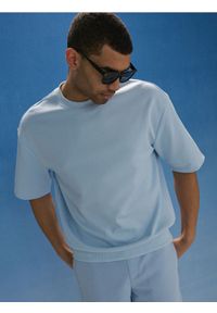 Sinsay - Bawełniana bluza z krótkim rękawem - błękitny. Kolor: niebieski. Materiał: bawełna. Długość rękawa: krótki rękaw. Długość: krótkie #1