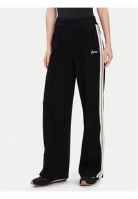 Guess Spodnie dresowe V5BB16 KCX52 Czarny Wide Leg. Kolor: czarny. Materiał: syntetyk #1